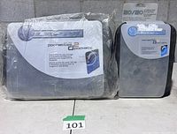 Front view of both sealed Slappa 20/20 and 40/40 CD/DVD cases showing model labels and packaging