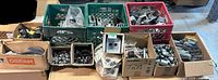 Overview of crates and boxes filled with electrical fittings and covers