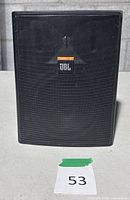 Front view of JBL Control 25T speaker showing grille and logo