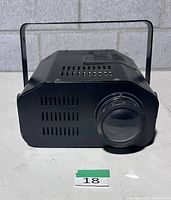 Front view showing lens and ventilation slots