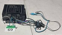 Top view of Aspec AMP-300 amplifier with wiring and RCA leads