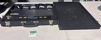 Open road case showing Nady 401 receiver, four belt packs, and accessories