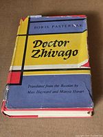 Front cover with dust jacket showing title and author, significant wear