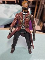 Front view of Star-Lord figure standing with both blasters