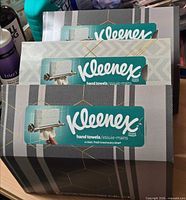 Front view showing three sealed Kleenex hand towel boxes