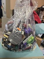 Front view of clear bag showing mixed LEGO pieces