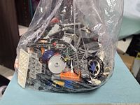 Full view of sealed clear bag containing mixed LEGO parts