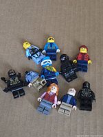 Group shot of all ten minifigures on cardboard surface