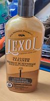Front label showing Lexol All Leather Cleaner branding, size, safety info