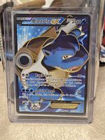 Front of Blastoise EX full art card in toploader