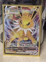 Front of Jolteon VMAX card in sleeve showing artwork and card number
