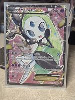 Front of Meloetta EX card in protective sleeve