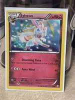 Front of Sylveon holo card showing artwork and stats