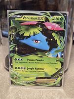 Front of sleeved Venusaur EX card in toploader
