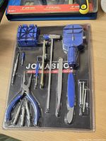 Front view of sealed blister pack showing all 16 tools