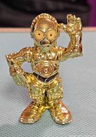 Front view of gold C-3PO figure standing