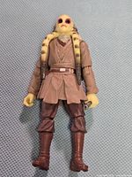 Front view of Kit Fisto figure showing attire and accessory