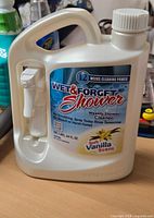 Front label showing brand, product name, size, scent, unopened cap