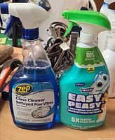 Front view of both unopened cleaner bottles