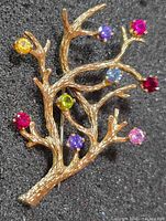Front view showing branch design and multicolour stones