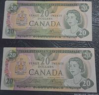 Front view of both $20 Canadian banknotes