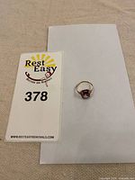 Ring beside lot card showing overall item