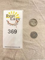 Lot overview with both coins next to lot card