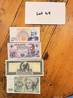 Four banknotes laid out showing obverse designs