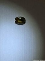 Top view of oval sapphire showing colour zoning and facet pattern