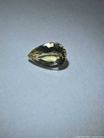 Pear cut pale yellow scapolite gemstone top view