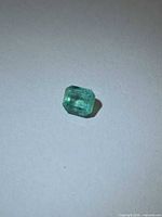 Loose octagon-cut emerald front view