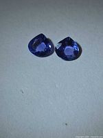 Pair of pear-cut violet-blue tanzanites