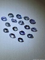 Group of oval Tanzanites under direct light