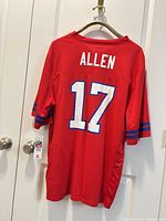Back of red Buffalo Bills #17 Allen jersey hanging with tag visible