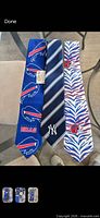 Front view of all three neckties laid flat