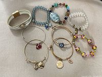 All nine bracelets laid out showing variety of styles and colours