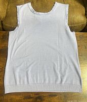 Front view of lavender sleeveless tank top laid flat