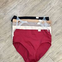 Stack of five high-waist briefs in assorted colors