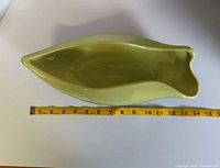 Top view showing interior shape and measuring tape indicating length