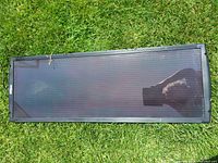 Full view of solar panel on grass