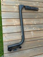 Full view of L-shaped steel rack showing hitch shank and vertical arm