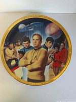 Front view of Star Trek 25th Anniversary plate showing full artwork and gold rim