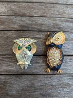 Both owl brooches side by side showing size, colors, overall design