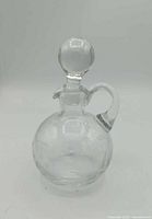 Full view of clear glass cruet front