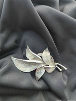 Front view of silvertone leaf spray brooch