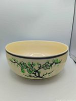 Full view of porcelain bowl exterior with cherry blossom decoration