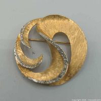 Front view showing swirl design and rhinestones