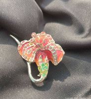 Front view showing enamel colours and rhinestones