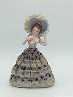 Full front view of porcelain girl figurine standing