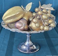 Compote bowl shown with decorative fruit to illustrate use and scale
